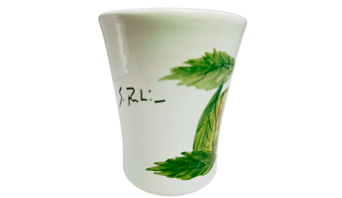 Susan Rubin Golden Apple Mug middle view with curved white handle, partial S. Rubin signature, and glossy flared ceramic body.