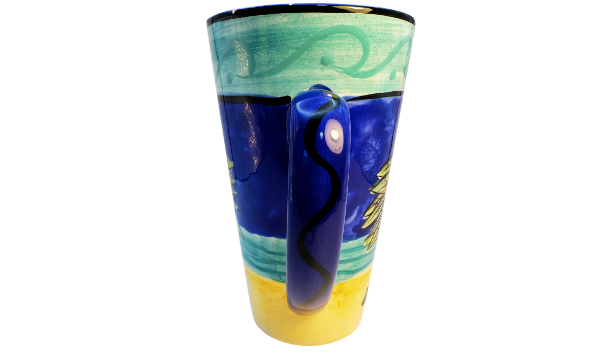 Certified International Palm Tree Latte Mug handle view featuring glossy blue handle with decorative black accent