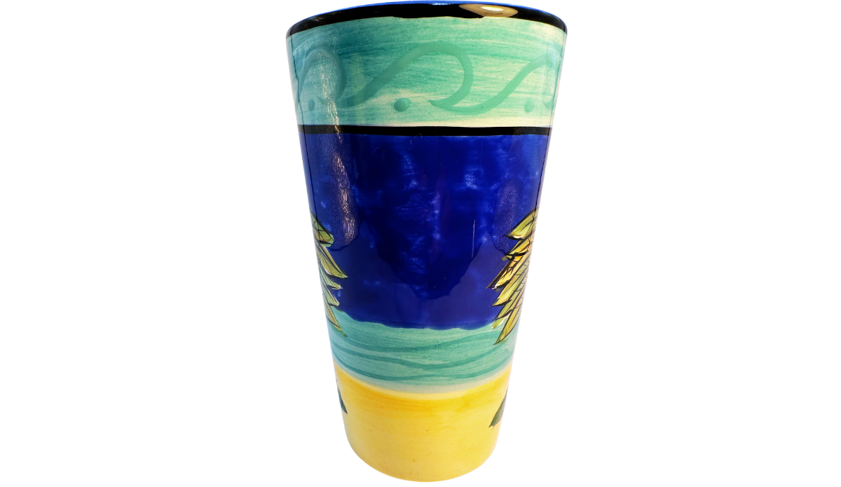 Certified International Palm Tree Latte Mug angled middle view showing the palm tree artwork and wide opening