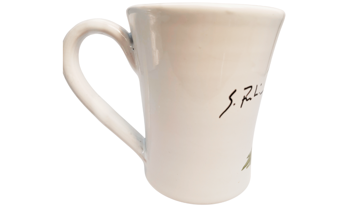 Susan Rubin Golden Apple Mug back view with black S. Rubin signature, hand-painted green leaves, and partial golden fruit artwork.