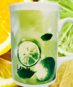 Watercolor Lemon Lime Coffee Mug displayed with bright lemon and lime slices, soft green citrus artwork, and a white handle.