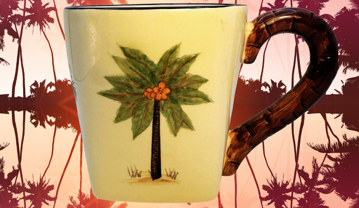 Pacific Rim Palm Tree Hand Painted Ceramic Mug displayed against a tropical palm tree sunset backdrop