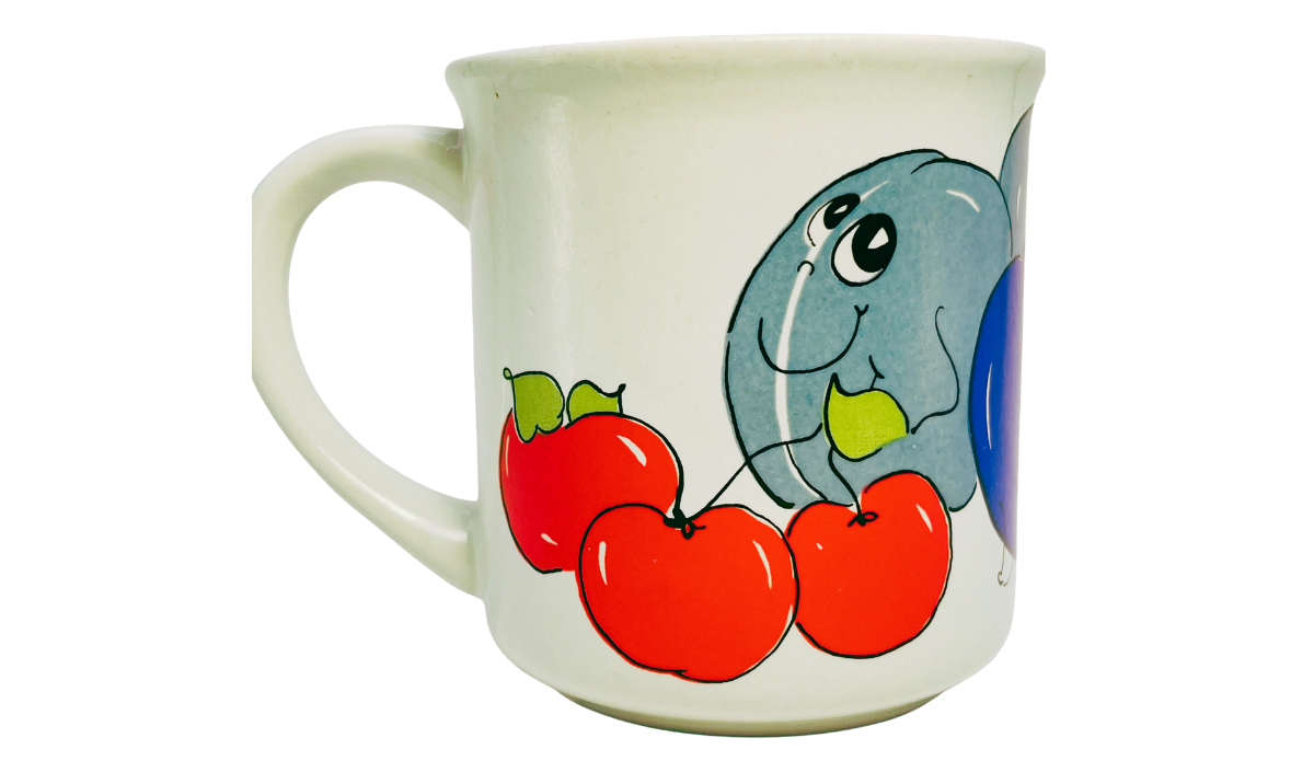 Nancy Lynn Plums and Cherries Mug back view with smiling blue plums, red cherries, green accents, and bold cartoon outlines.