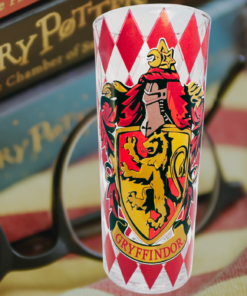 Harry Potter Gryffindor House Crest Glass displayed with Harry Potter books, reading glasses, and a cozy blanket