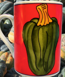 Vintage Acorn Squash Mug displayed among dark green acorn squashes with bold red artwork, golden stem, cobalt trim, and white handle.