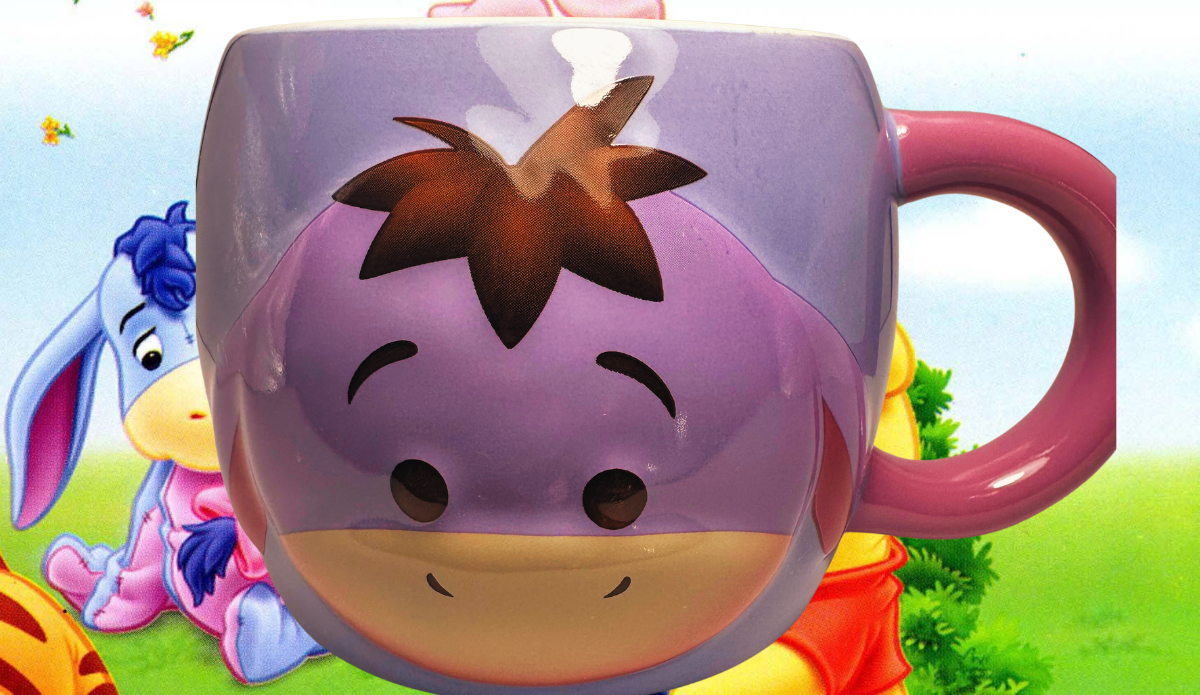 Disney Eeyore Tsum Tsum Mug displayed with Winnie the Pooh character background