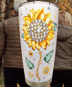 Happy Retirement Tumbler lifestyle scene with sunflower artwork and retired couple walking outdoors