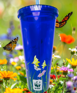 WWF butterfly tumbler displayed in colorful butterfly and wildflower meadow