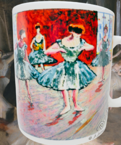 Edgar Degas ballerina mug displayed against an Edgar Degas ballet rehearsal painting