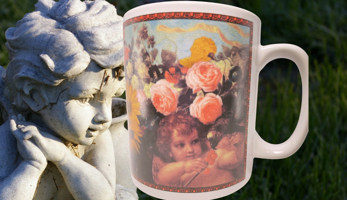 Cafe Arts Raphael Cherubs floral mug displayed beside a stone cherub statue in a garden