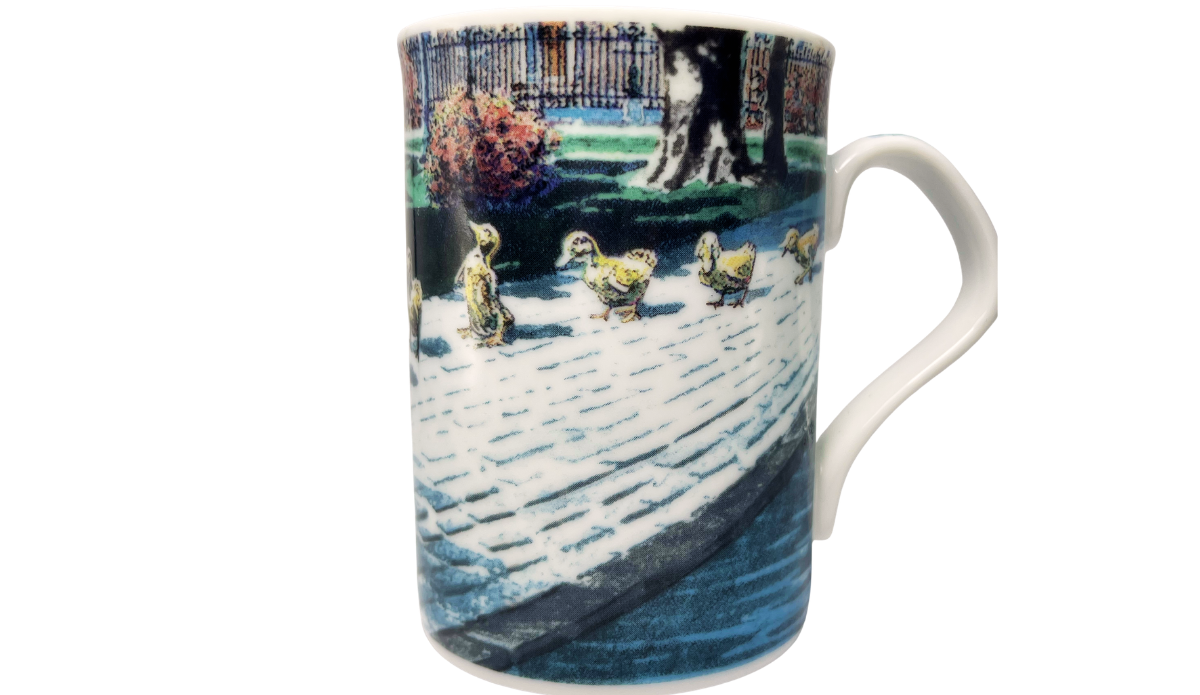 Ducklings II Mug front view with yellow ducklings walking beside water in a colorful garden scene on fine porcelain.