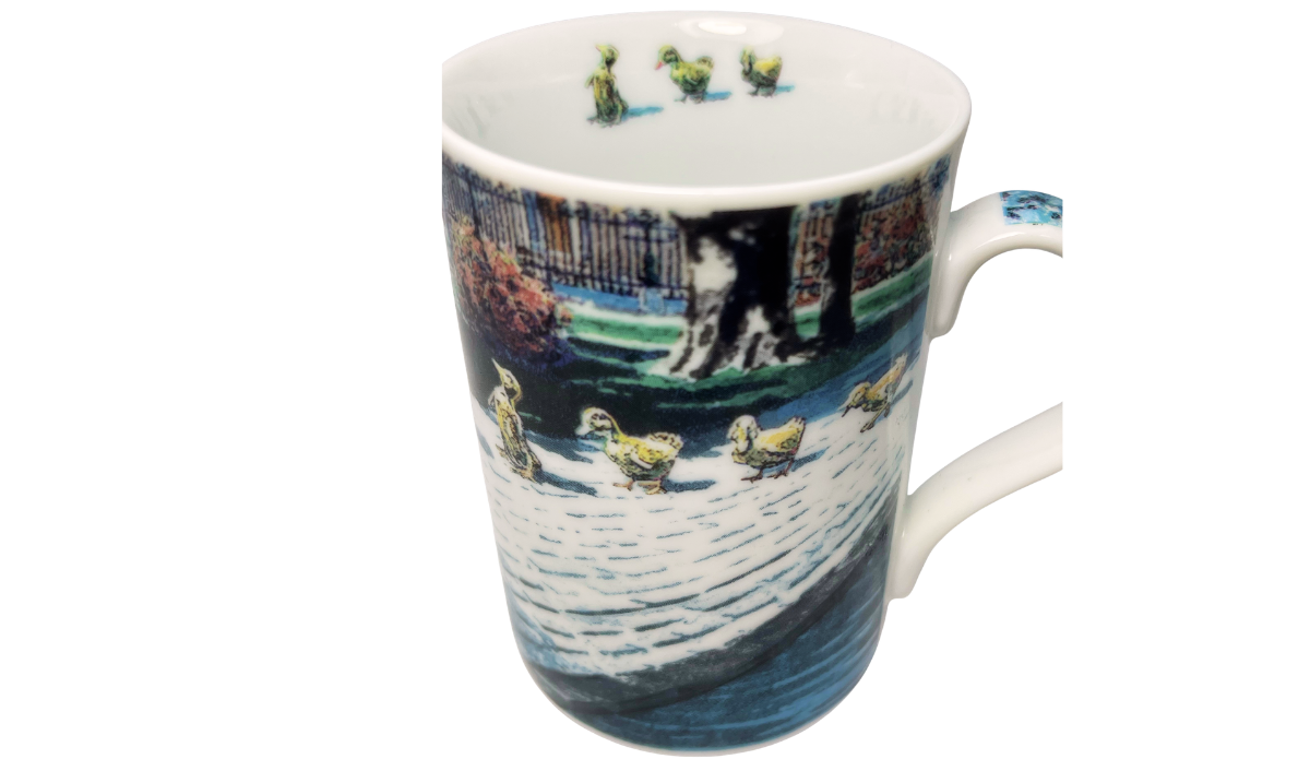 Ducklings II Mug inside view showing three small ducklings decorating the inner rim above the wraparound landscape.