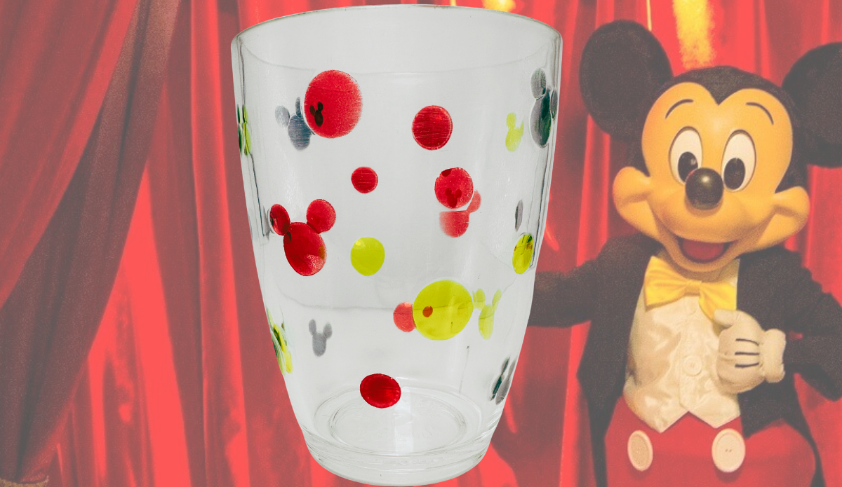 Vintage Disney Mickey Mouse clear acrylic tumbler displayed with Mickey Mouse backdrop