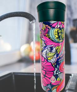 TAL Floral Water Bottle lifestyle scene beside kitchen sink with colorful floral artwork