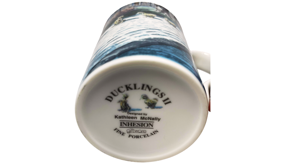 Ducklings II Mug bottom view showing Kathleen McNally, Inhesion Giftware, and Fine Porcelain backstamp details.