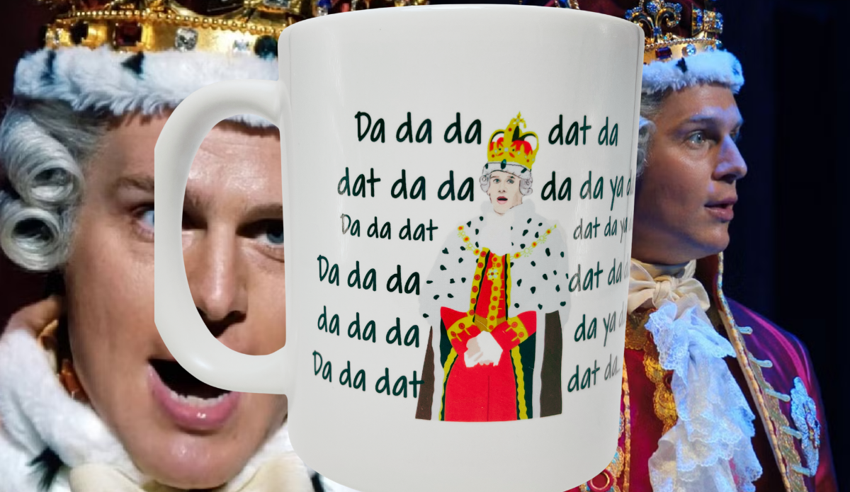 Hamilton King George mug displayed against King George III stage scenes from Hamilton