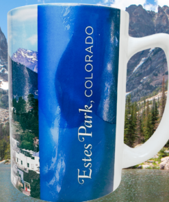 Estes Park Colorado scenic souvenir mug displayed against mountain lake evergreen trees and rocky peaks