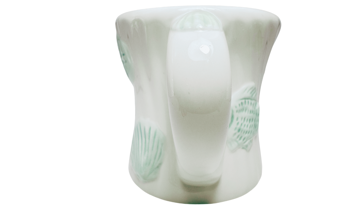Seafoam Green Seashell Mug handle view with raised marine designs around white ceramic body
