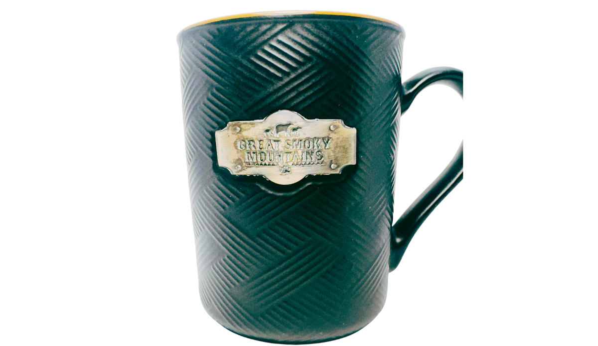 Great Smoky Mountains Medallion Souvenir Mug front view with black basket weave texture and metallic bear plaque