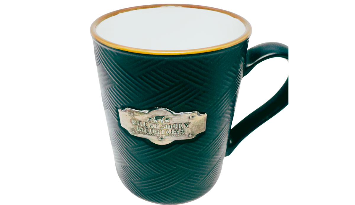 Great Smoky Mountains Medallion Souvenir Mug top view with white interior golden rim black texture and bear plaque