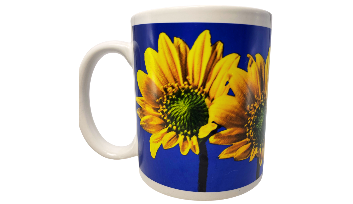 Sunflower Blue Sky Mug front angle with large yellow sunflowers, green centers, vivid blue sky, and white handle
