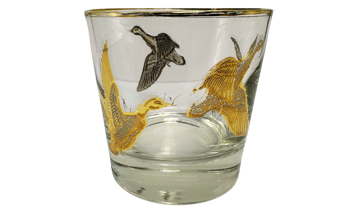 Game Bird Whiskey Glass with gold and dark flying bird artwork