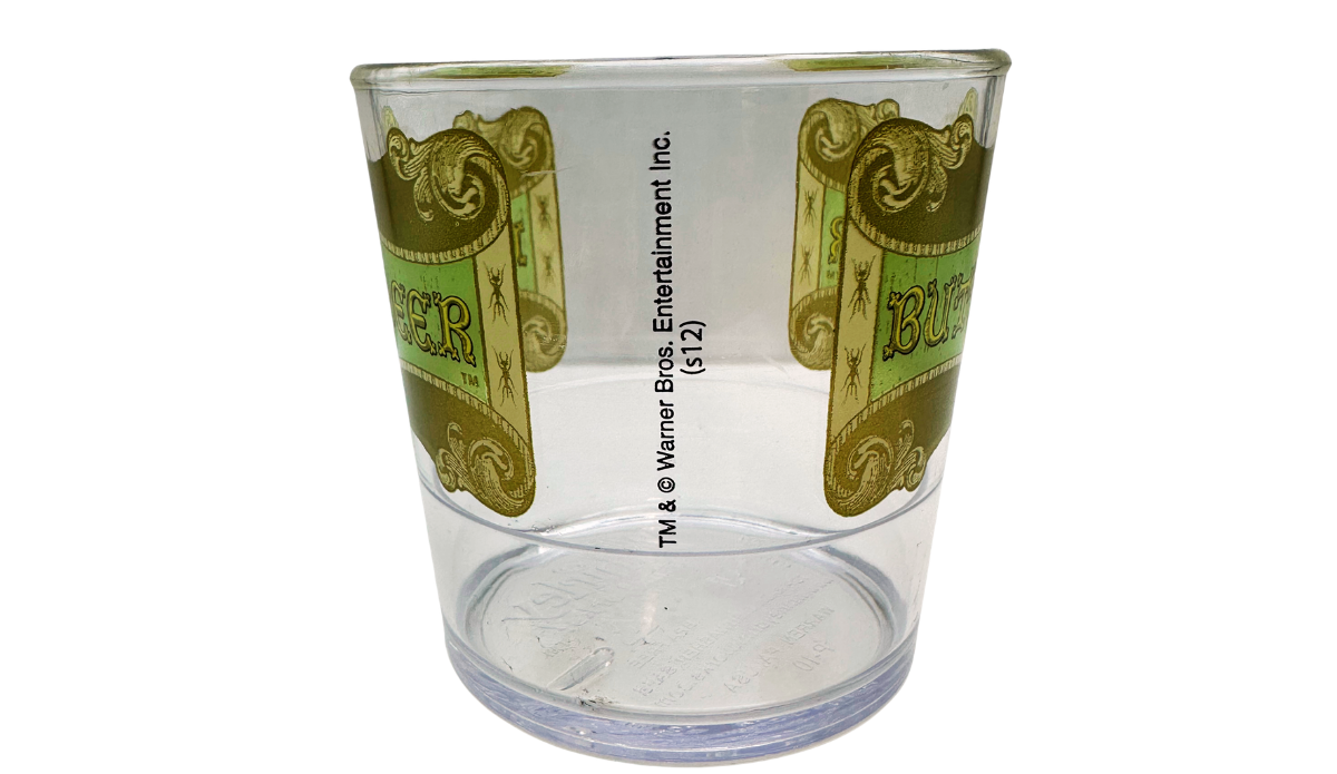 Harry Potter Clear Butterbeer Souvenir Cup side view with wraparound artwork and Warner Bros. marking