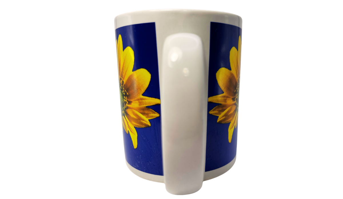 Sunflower Blue Sky Mug handle view with white ceramic handle between two blue sunflower panels