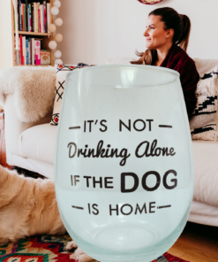 Not Drinking Alone Dog Wine Glass displayed beside a dog and woman in a cozy living room