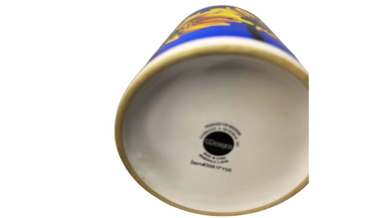 Sunflower Blue Sky Mug bottom view showing printed maker and production markings on white ceramic base