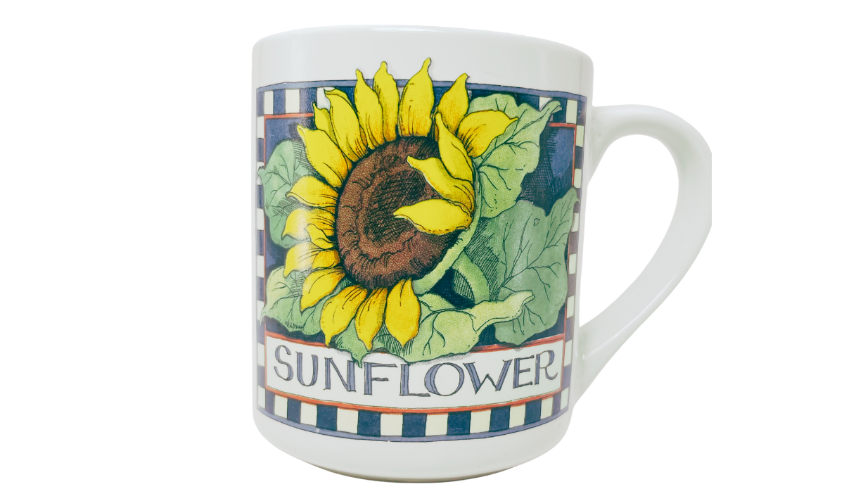Susan Winget Sunflower Coffee Mug back view with large sunflower, green leaves, checkerboard border, and SUNFLOWER lettering
