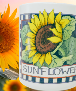 Susan Winget Sunflower Coffee Mug displayed beside a large sunflower with warm golden floral background