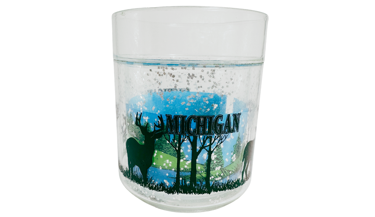 Michigan Deer Glass back view with Michigan lettering, deer silhouettes, trees, and woodland scenery
