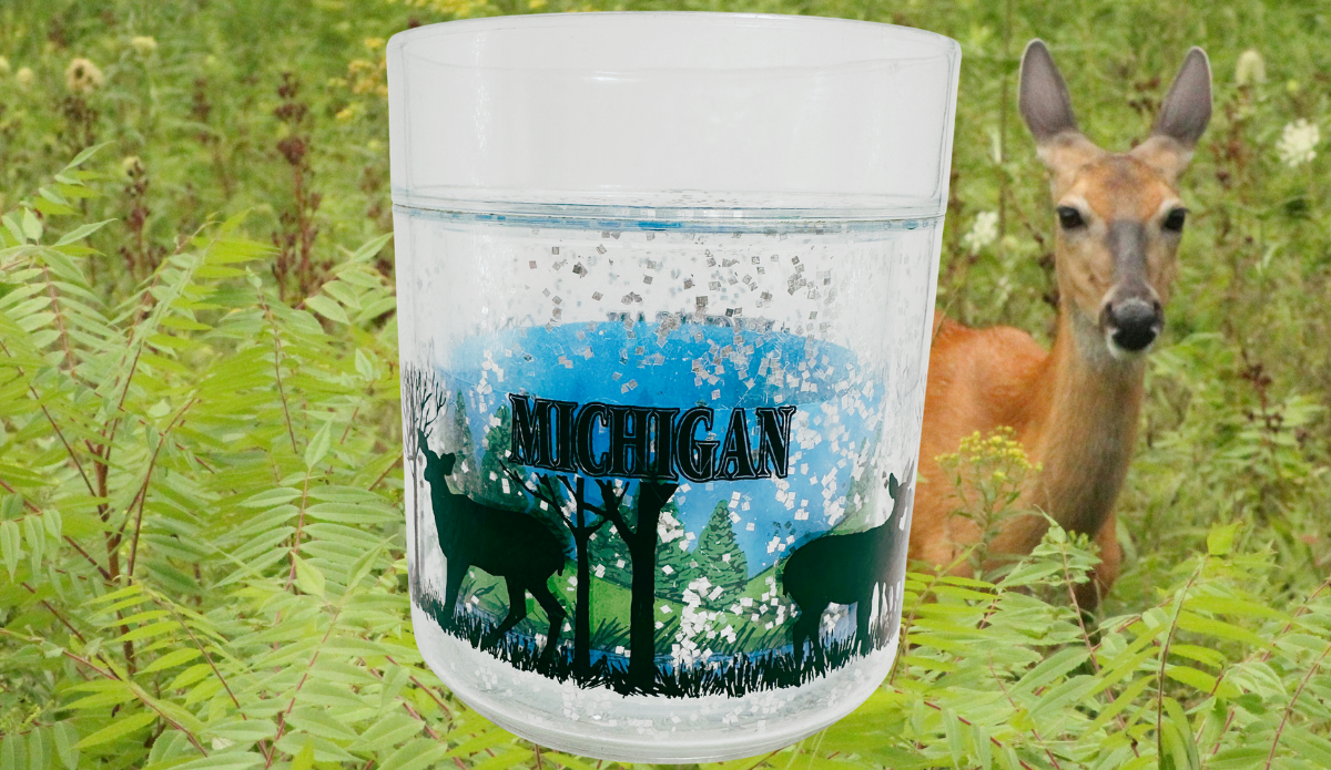 Michigan Deer Glass displayed in a green woodland setting with a deer in the background