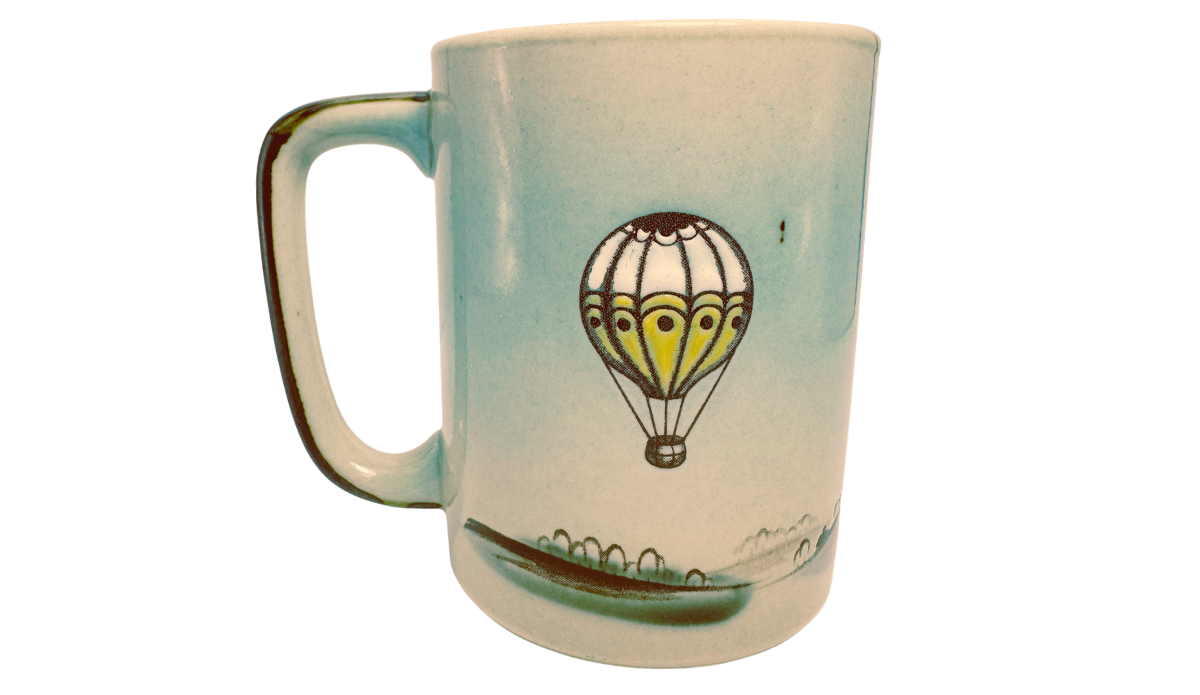 Back view of Otagiri Hot Air Balloon Coffee Mug with yellow balloon and landscape