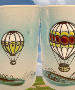 Otagiri Hot Air Balloon Coffee Mug displayed with cloudy sky and open countryside