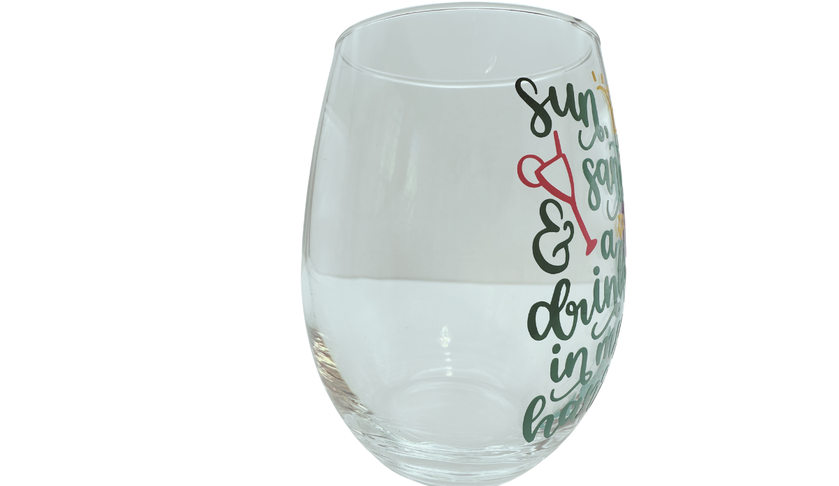 Sun Sand Drink Stemless Wine Glass right side view with clear body and partial beach quote
