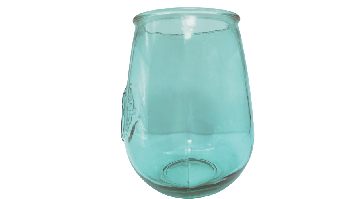 San Miguel teal recycled glass stemless wine glass with embossed medallion visible along the left edge