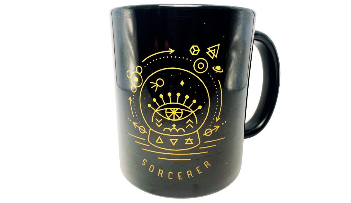 Sorcerer Crystal Ball Coffee Mug front view with gold-tone mystical artwork on glossy black ceramic