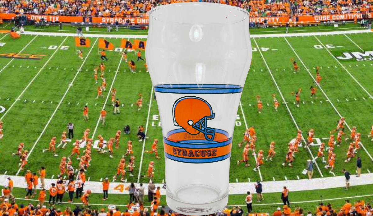 Syracuse University Football Coca Cola Glass displayed against a Syracuse football stadium backdrop
