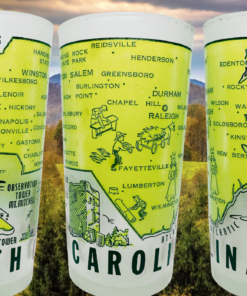 Three angles of the Vintage Hazel Atlas North Carolina map souvenir glass displayed against autumn mountain scenery and golden foliage