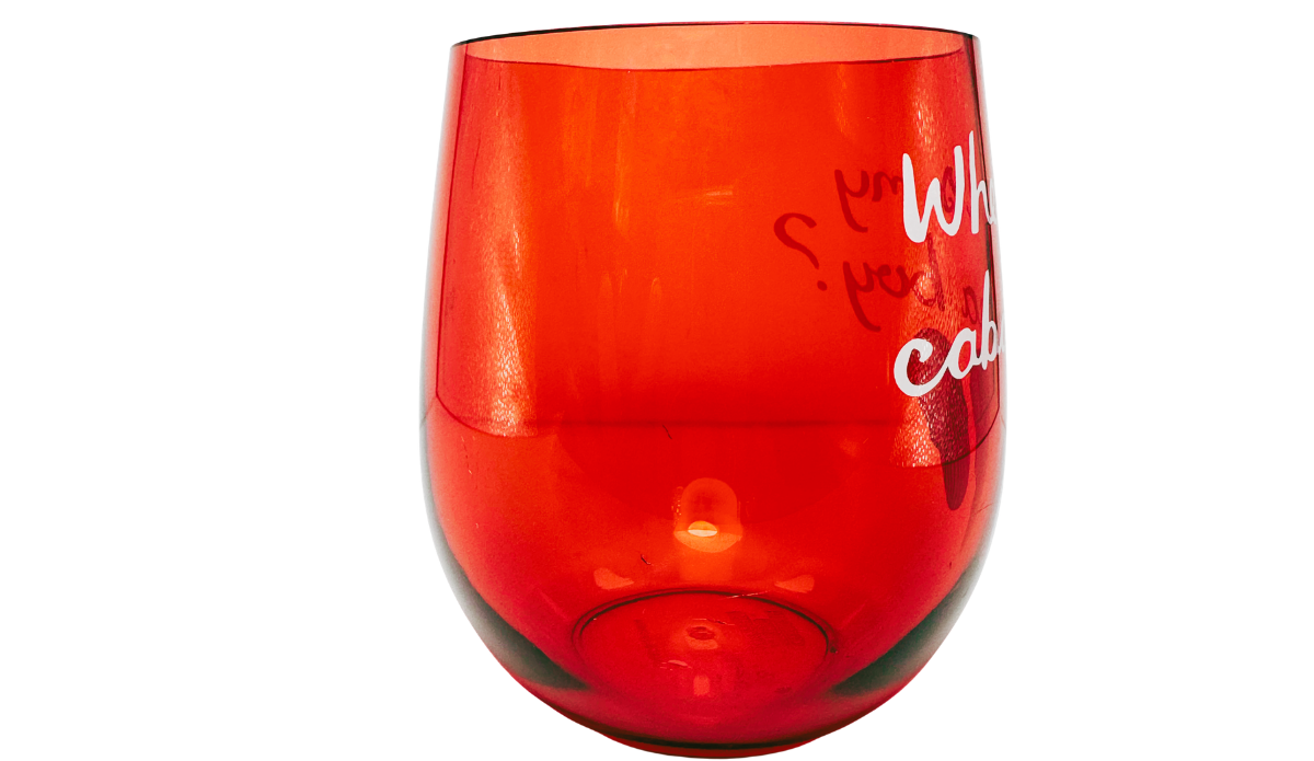 Cabana Boy Acrylic Wine Glass side view with translucent red body and partial cabana design