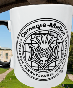 Carnegie Mellon University Black and White Mug displayed against a Carnegie Mellon campus backdrop