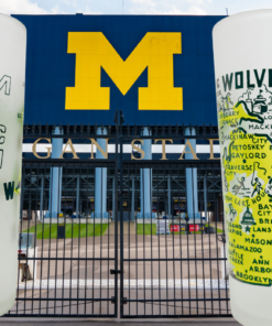 Vintage Michigan Yellow Map Glass shown in two views against a University of Michigan stadium setting