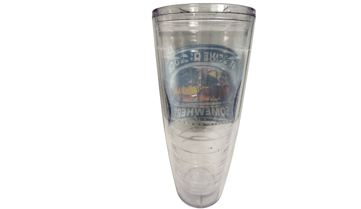 Back view of clear Margaritaville It's Five O'Clock Somewhere Sunset Tumbler showing reversed sunset artwork, palm trees, clock, and navy lettering.