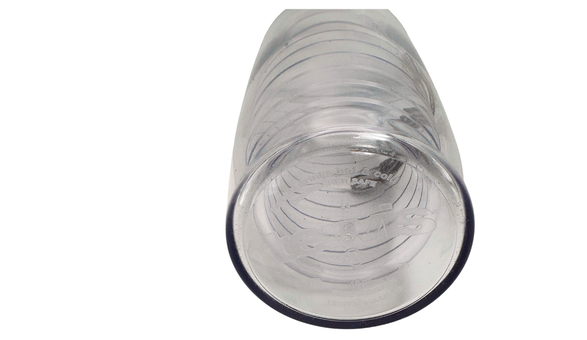Bottom view of clear Margaritaville sunset tumbler showing circular base, molded markings, and embossed details beneath the transparent cup.