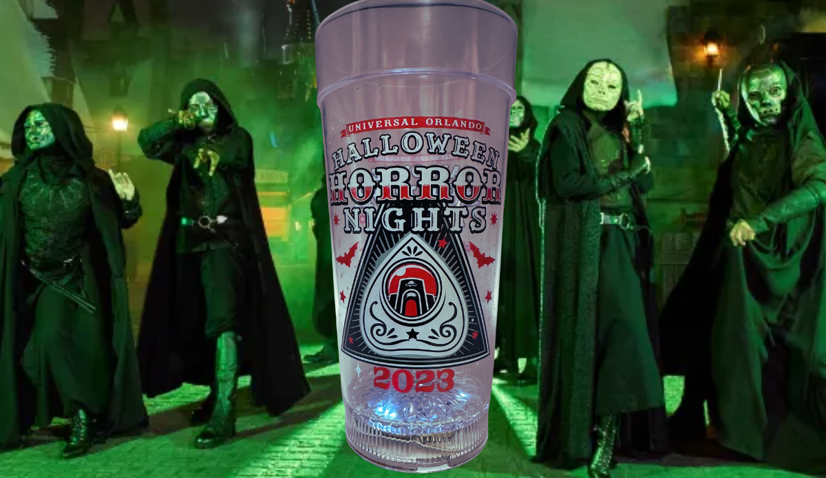 Halloween Horror Nights 2023 Light Up Cup displayed in a green lit spooky Universal Orlando inspired scene
