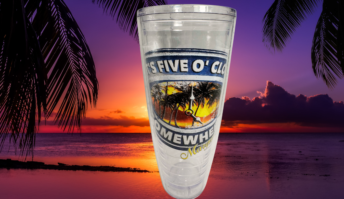 Margaritaville It's Five O'Clock Somewhere Sunset Tumbler displayed against a purple and orange tropical ocean sunset framed by black palm fronds.