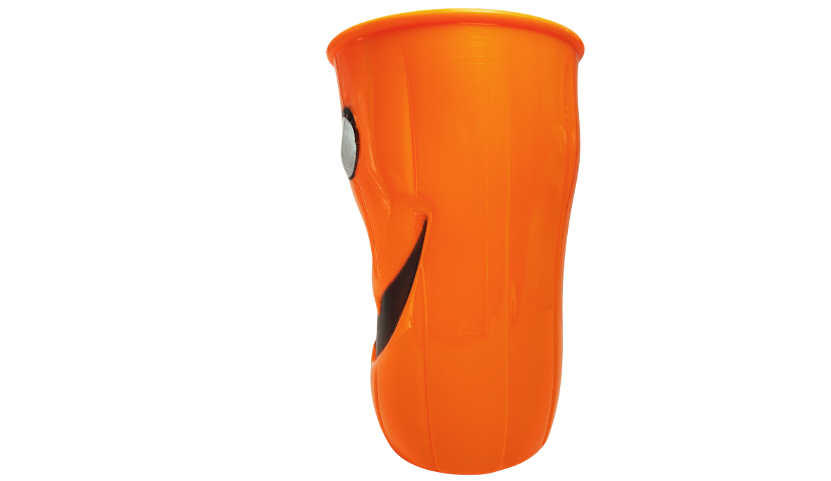 Left side view of 3D Jack-O'-Lantern Halloween Cup with bright orange ridges and partial black facial details