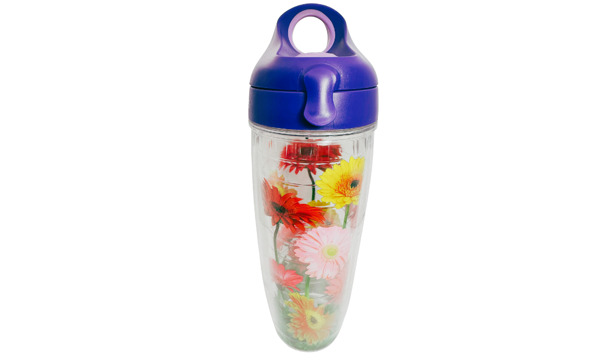 Tervis Gerbera Daisies Water Bottle With Purple Lid front view featuring colorful red, yellow, orange, and pink daisies and clear insulated body.